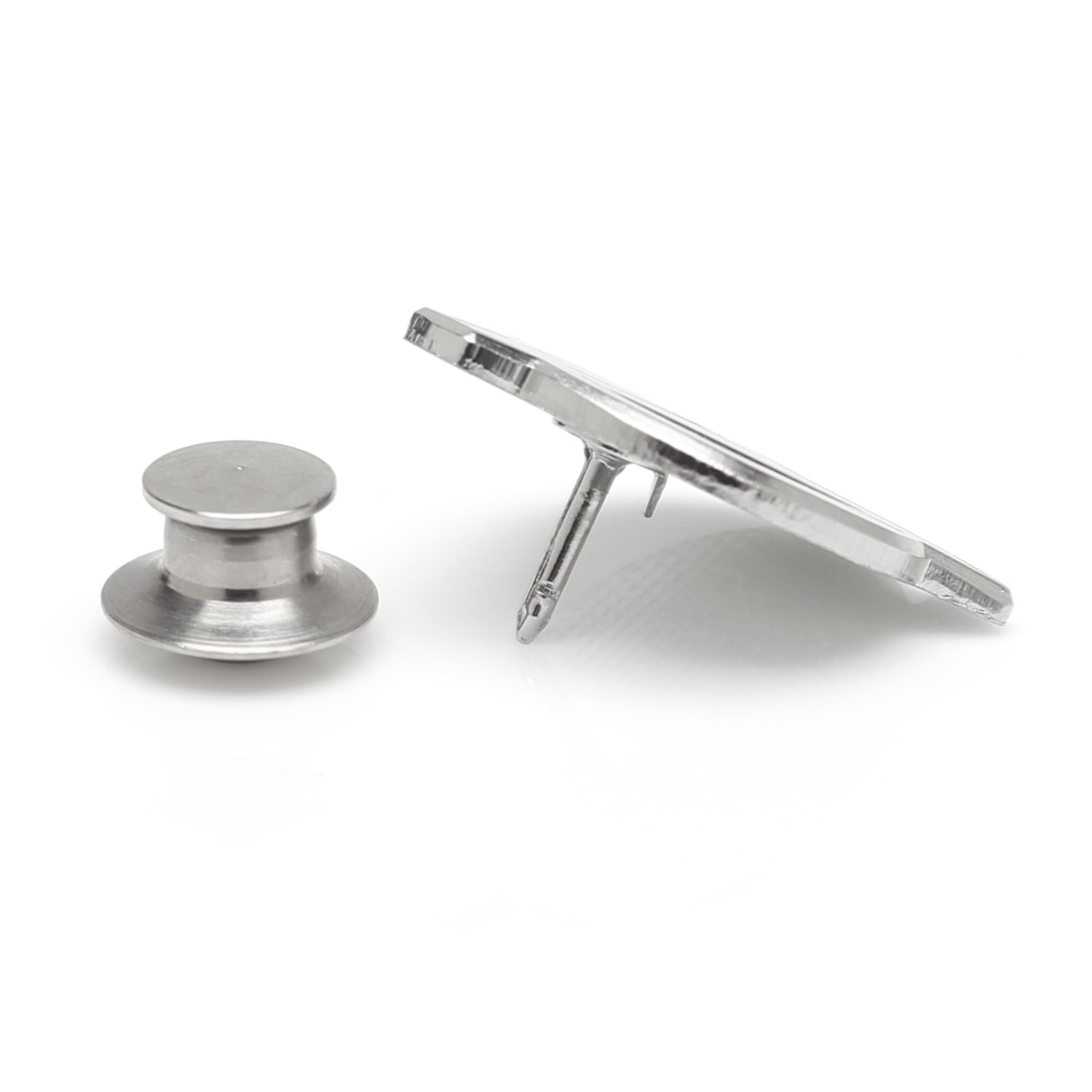 Metallic spool and bobbin on a white background