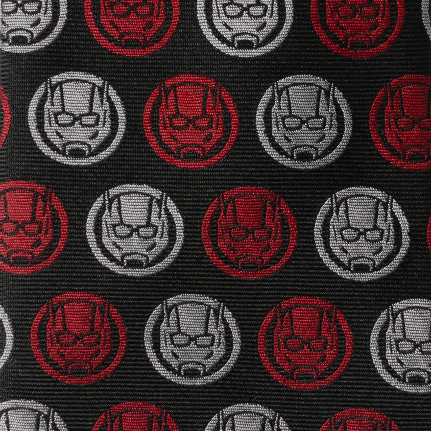 Pattern of red and gray superhero helmets on a black background