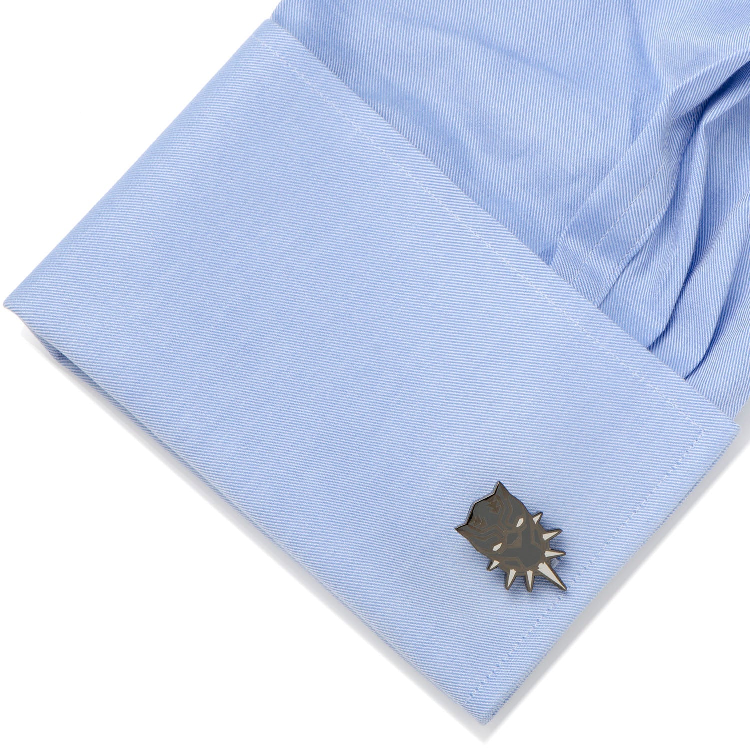 Cufflink on a light blue shirt sleeve