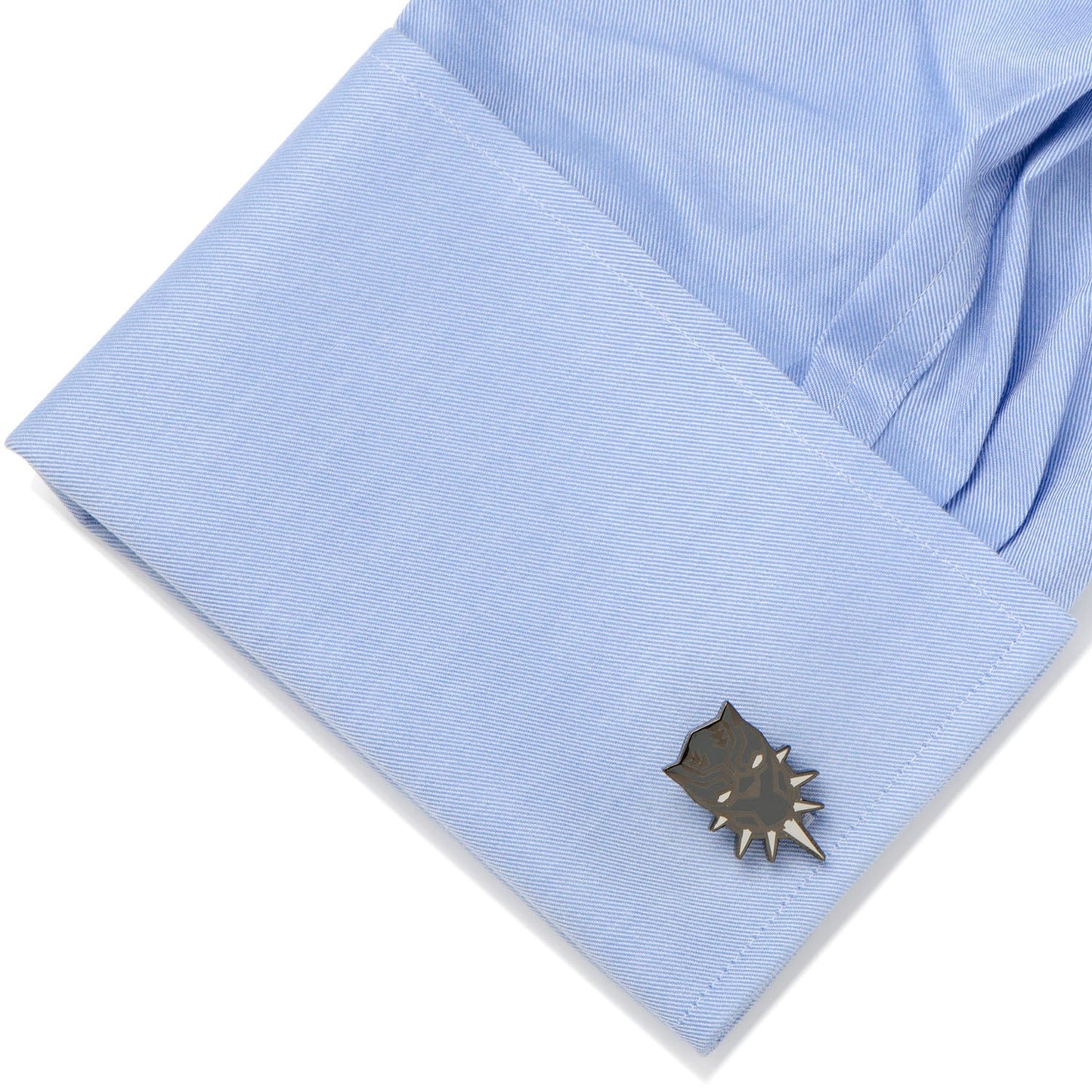 Cufflink on a light blue shirt cuff