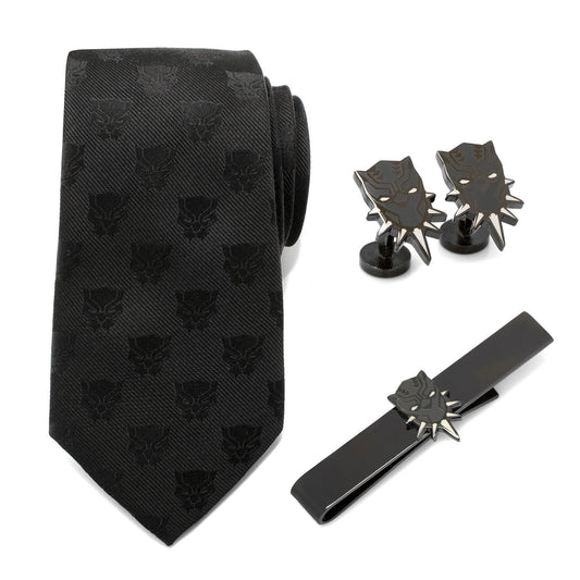 Black patterned tie with matching cufflinks and tie clip on a white background