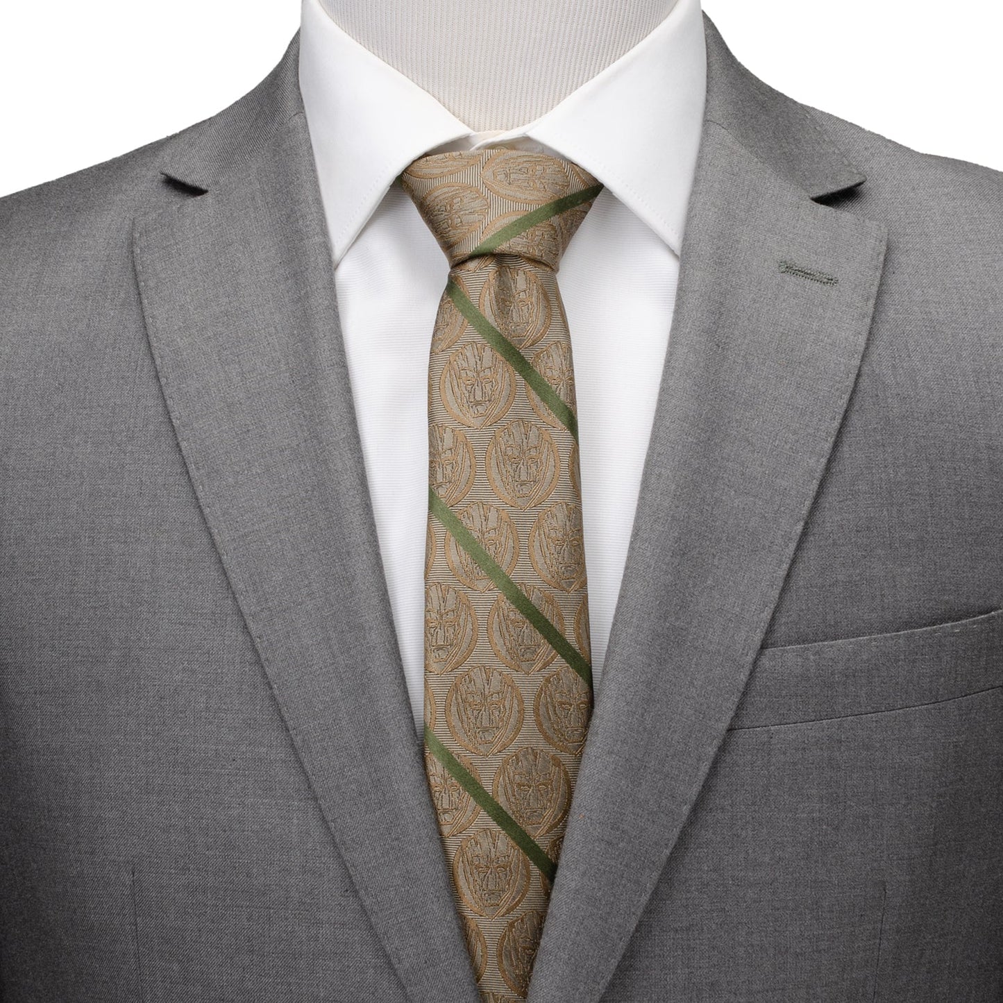 Gray suit jacket with a white shirt and patterned tie on a mannequin.