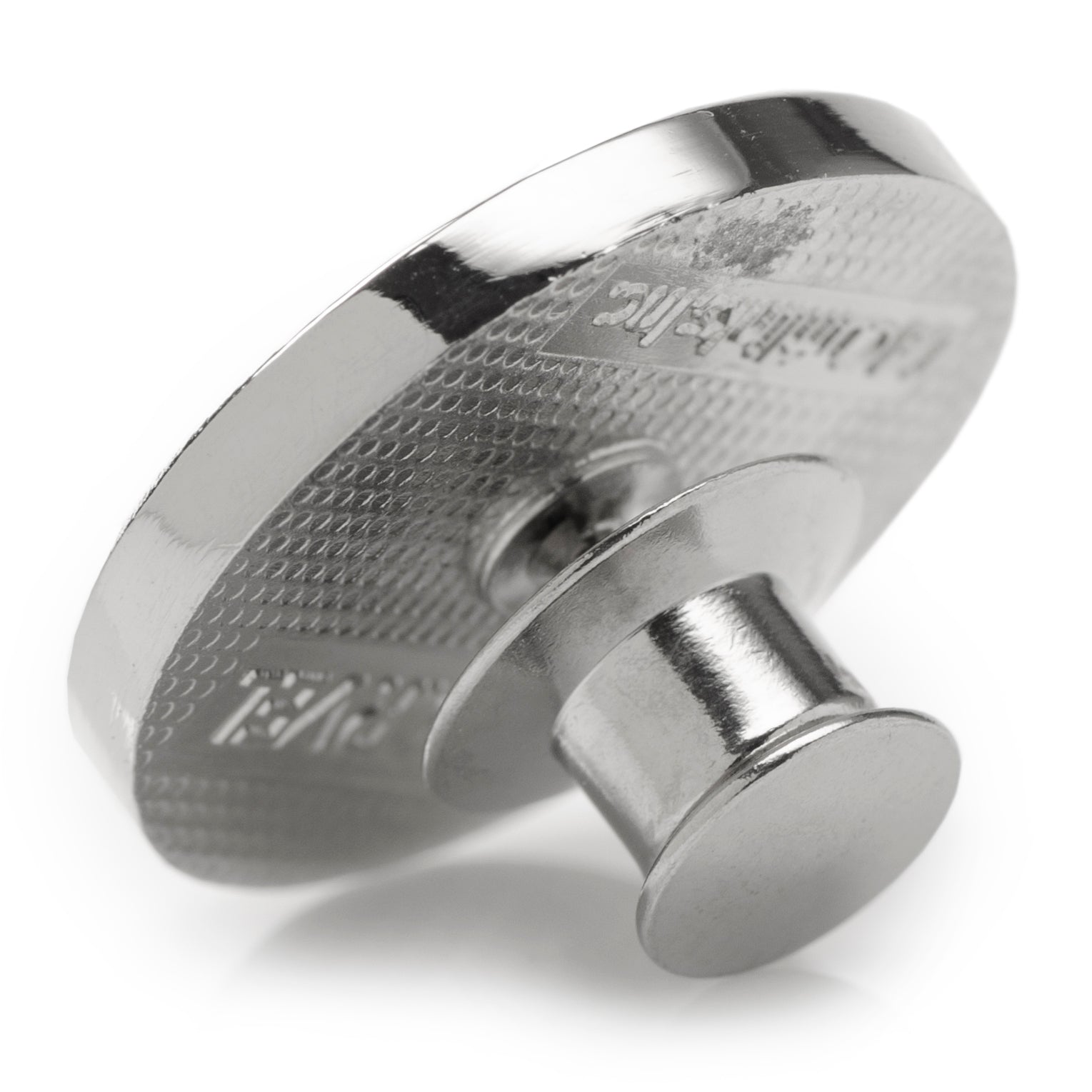 Metallic knob with textured surface on a white background
