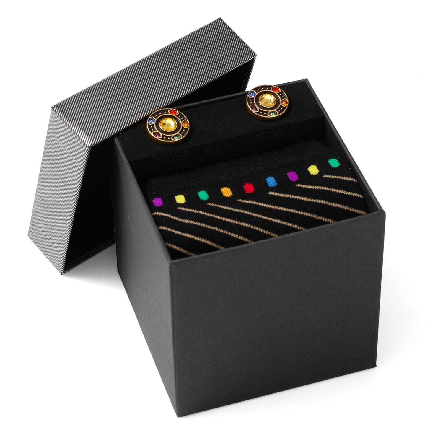 Black jewelry box with rainbow-colored earrings and a bracelet on a white background