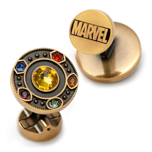 Gold cufflinks with gemstones and Marvel logo on a white background