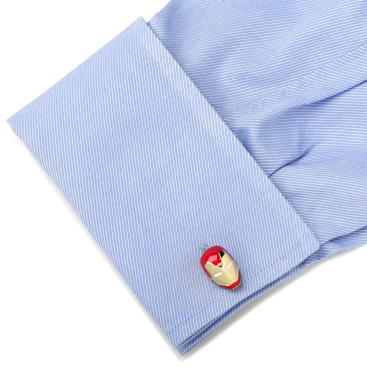 Cufflink on a blue striped shirt with a white background