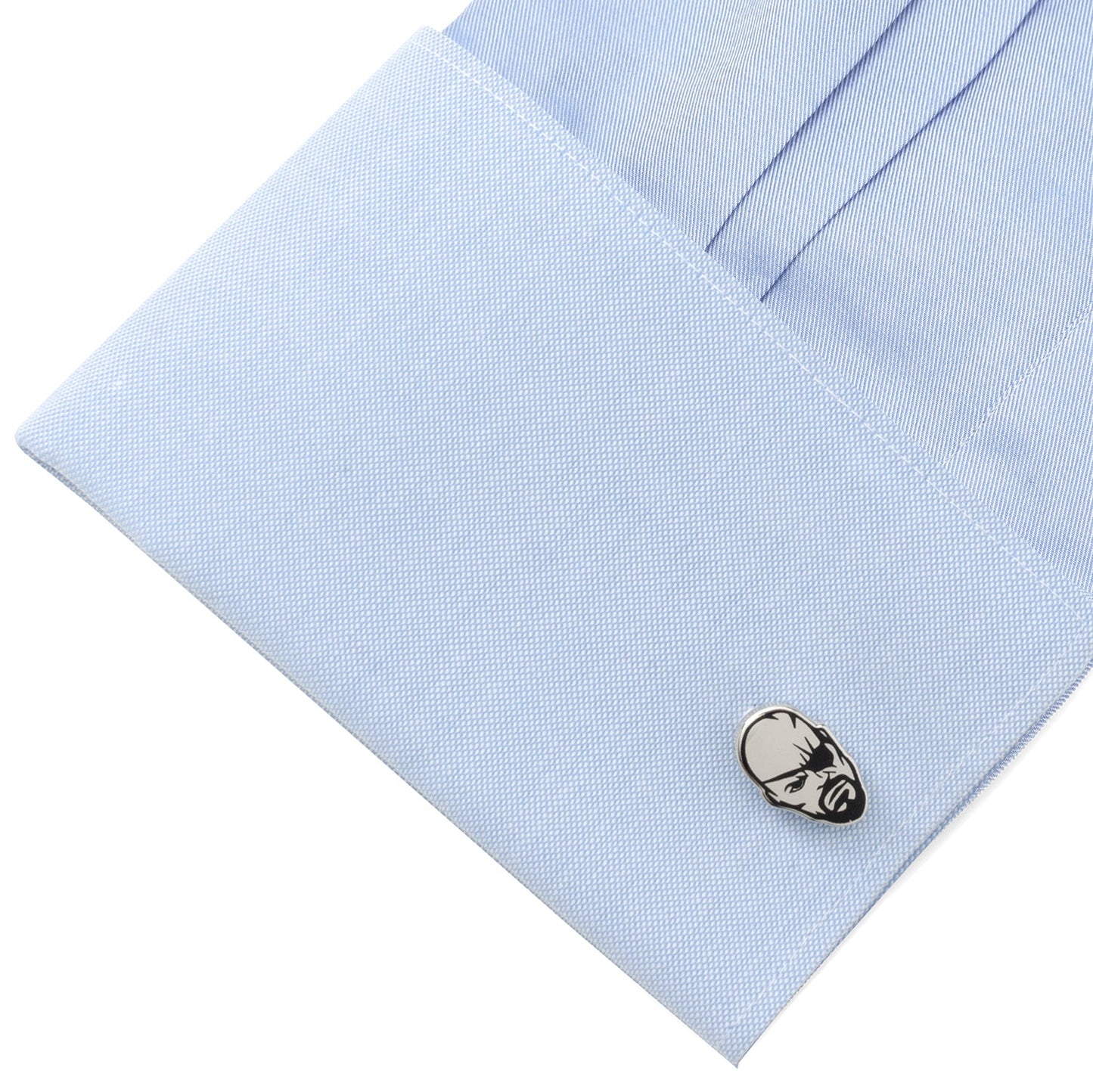Cufflink on a light blue dress shirt
