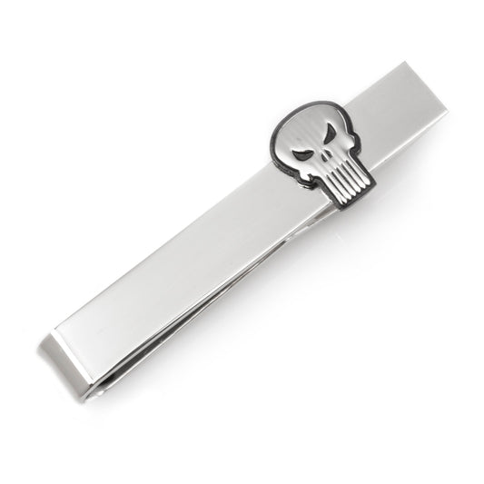 Silver tie clip with skull design on a white background