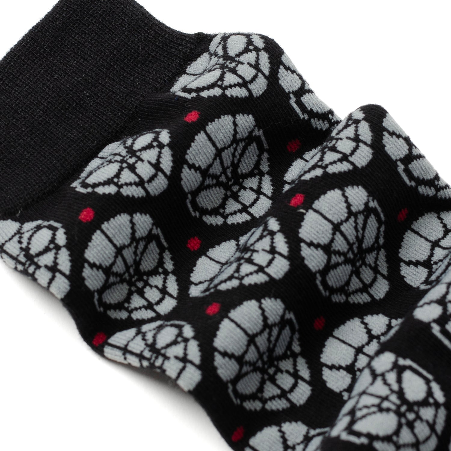 Black socks with white spider web pattern on a white background