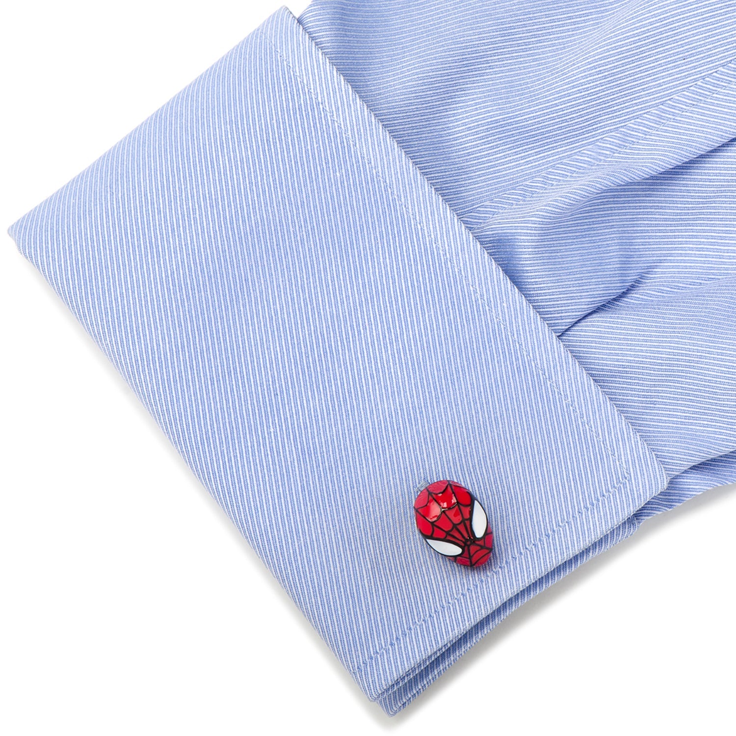 Cufflink with Spider-Man design on a blue striped shirt