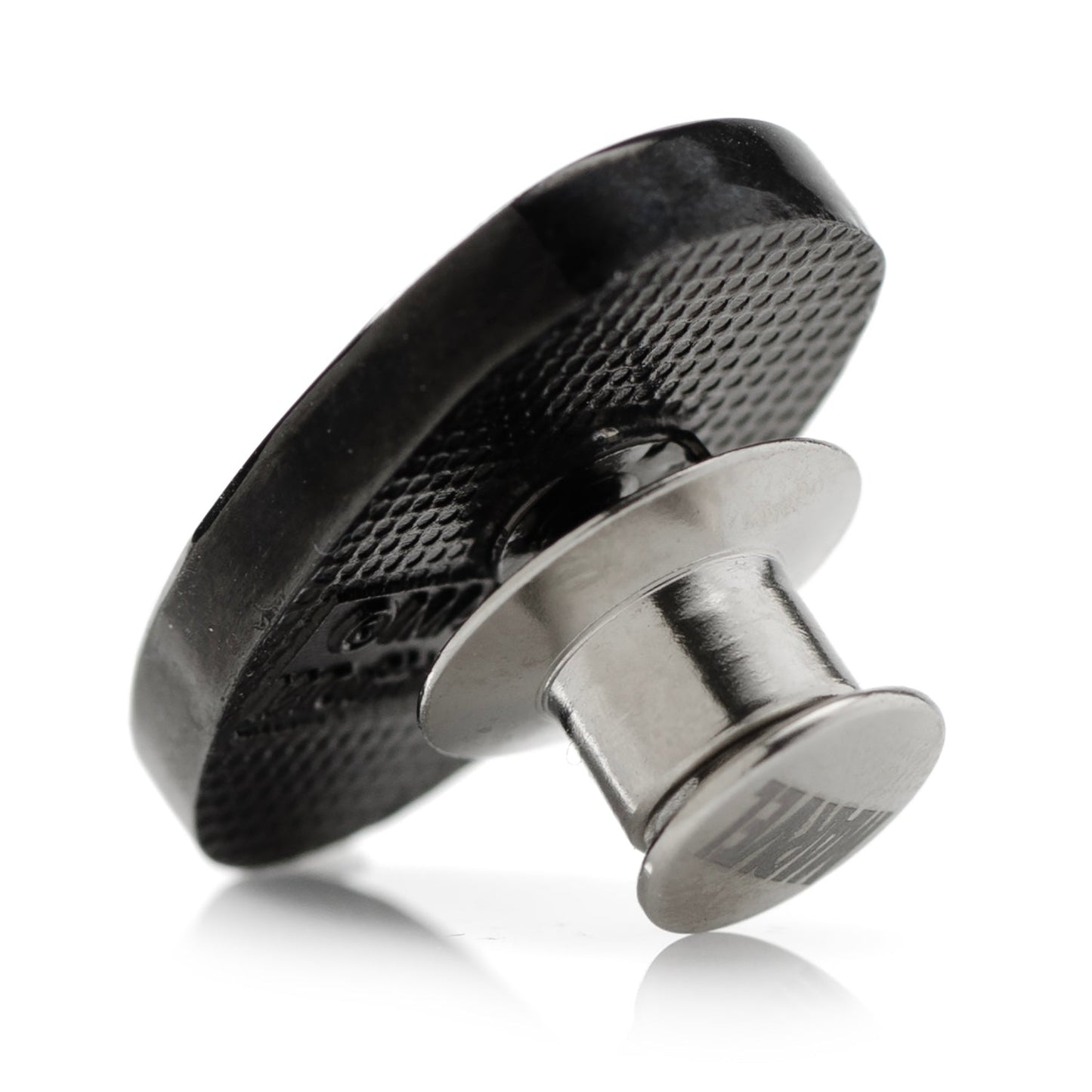 Black and silver magnetic clip on a white background