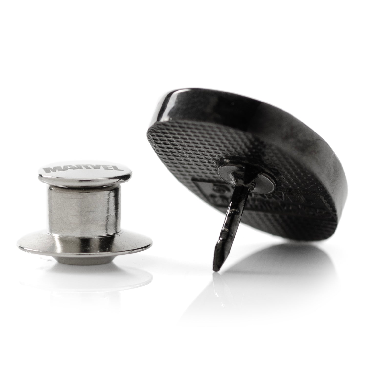 Metallic and black textured object on a white background