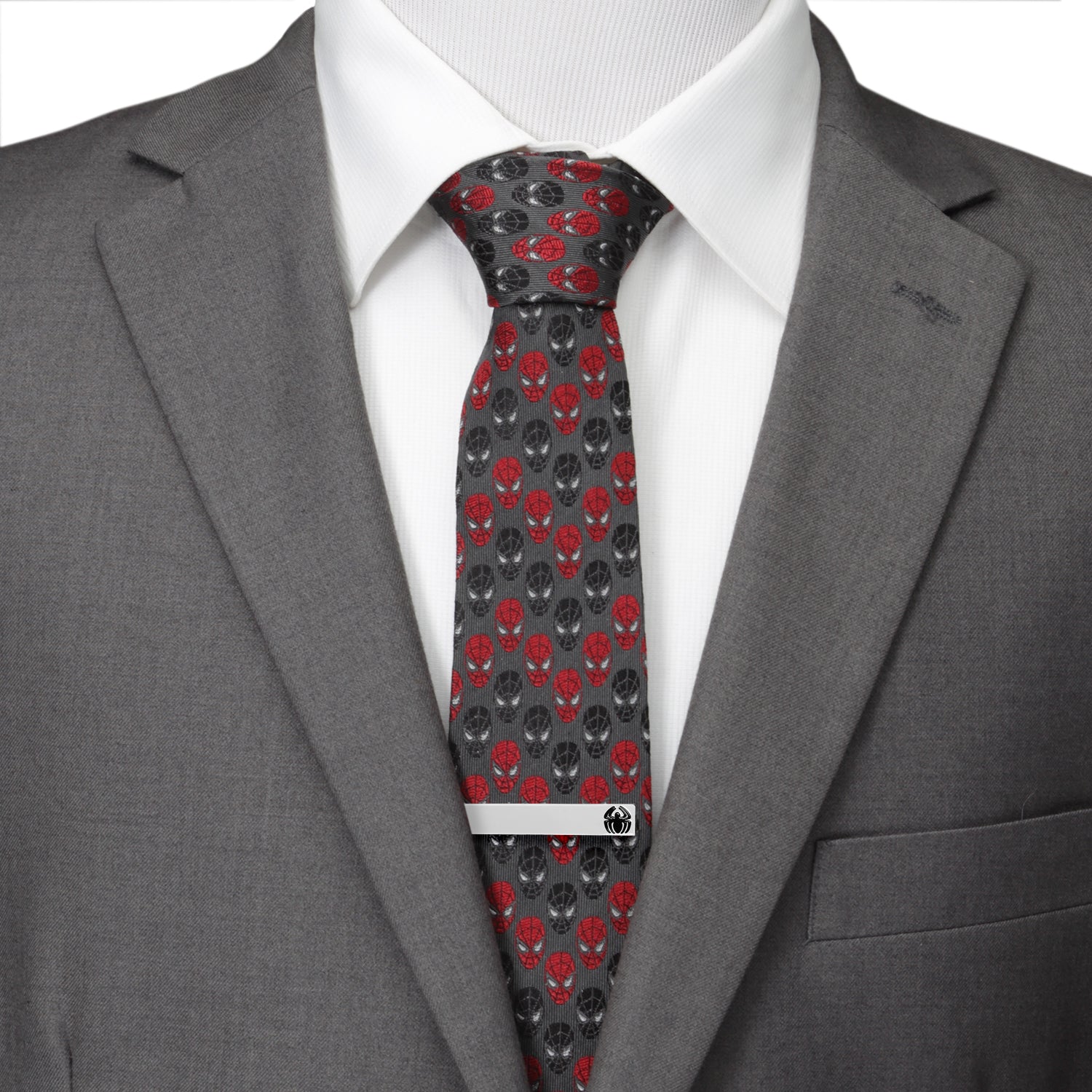 Gray suit jacket with a white shirt and red and black patterned tie.