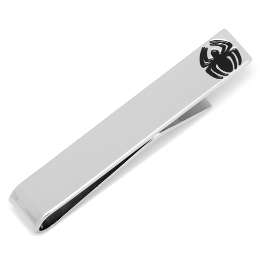 Silver tie clip with black spider design on a white background
