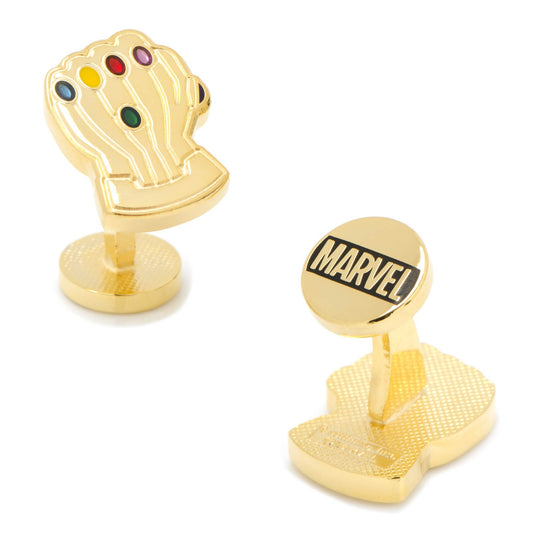 Gold cufflinks resembling a character from Marvel with colorful gemstones on a white background