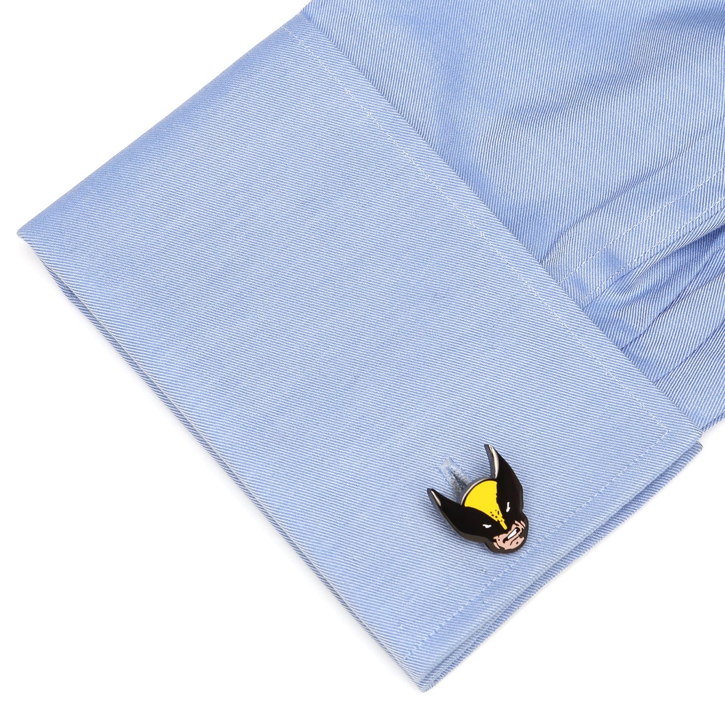 Cufflink on a light blue shirt cuff