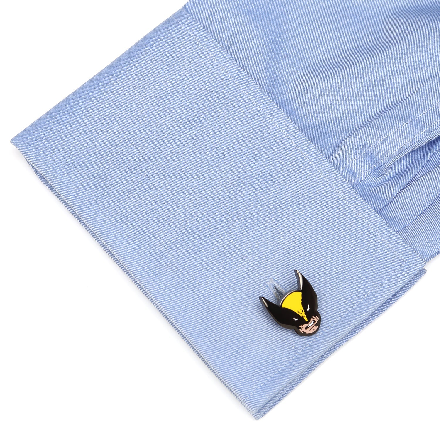 Cufflink on a light blue shirt cuff