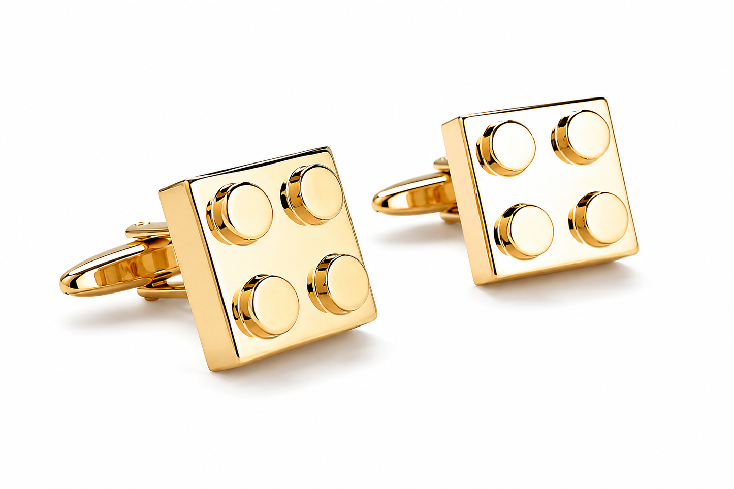Pair of gold building block cufflinks displayed together on a clean white background