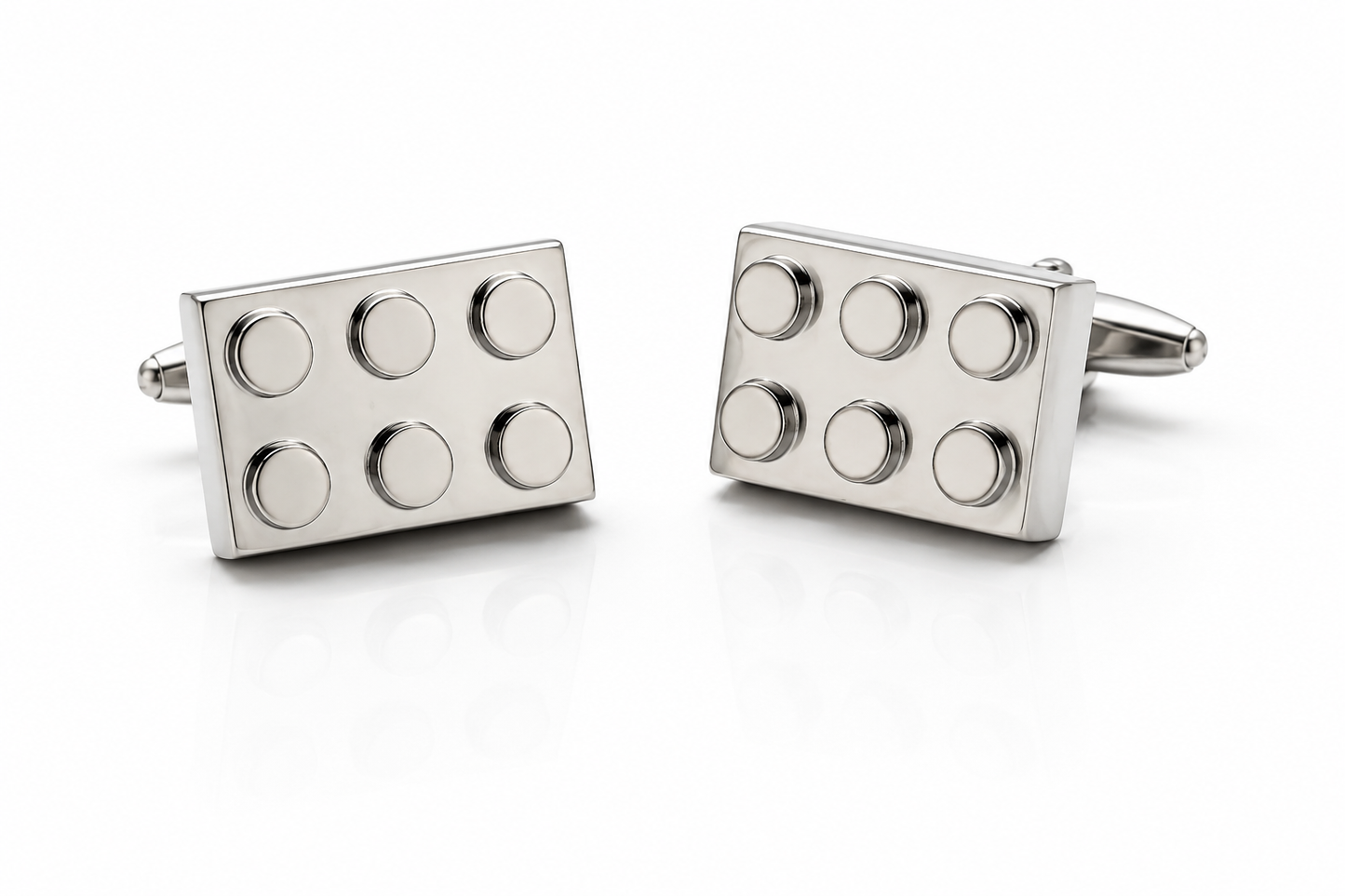 Silver building block cufflinks with polished metal finish displayed on white background