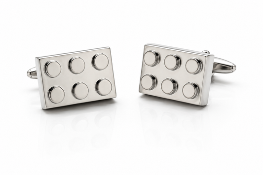 Silver building block cufflinks with polished metal finish displayed on white background