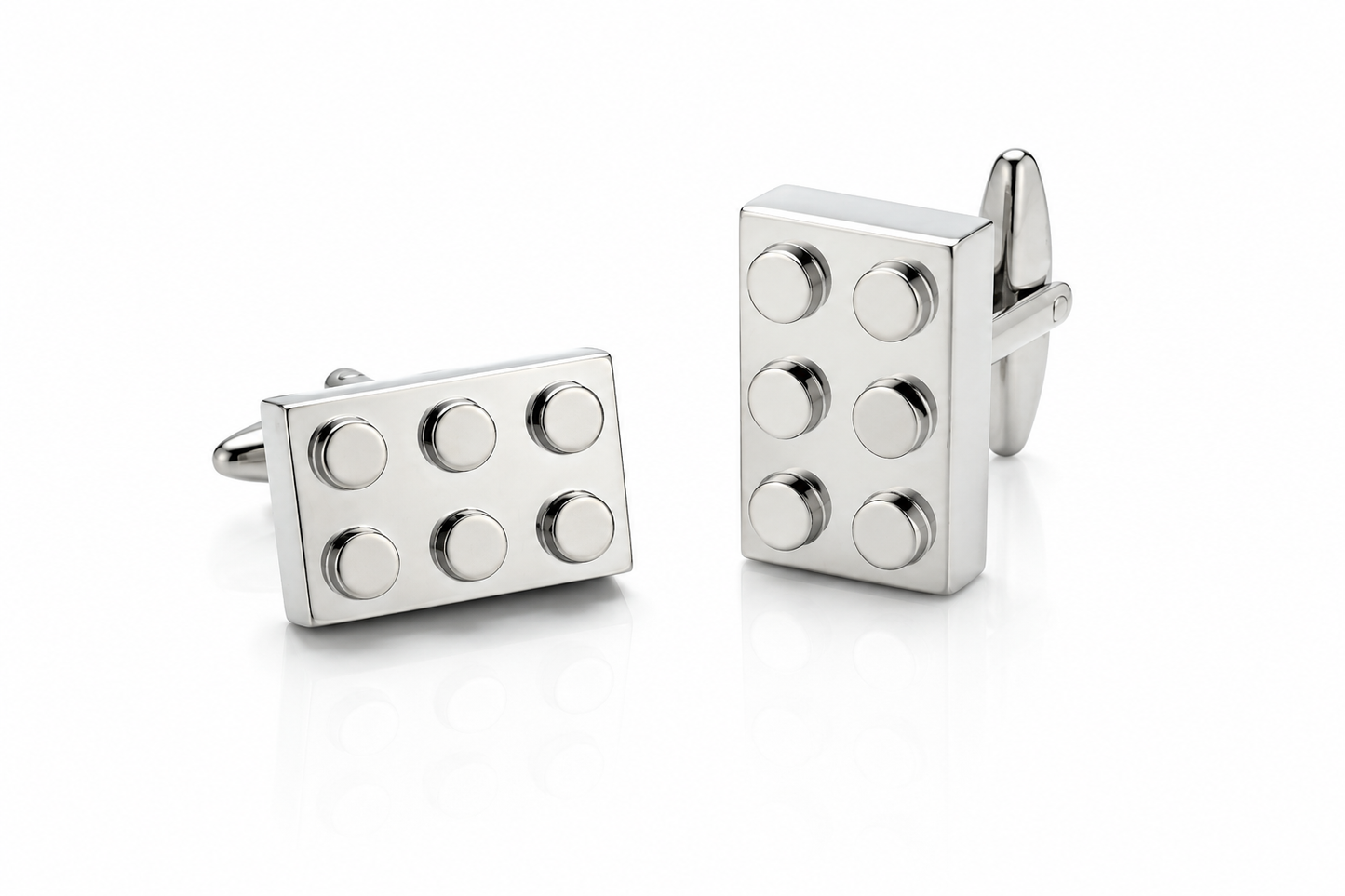 Pair of silver building block cufflinks featuring six raised studs and bullet back closures