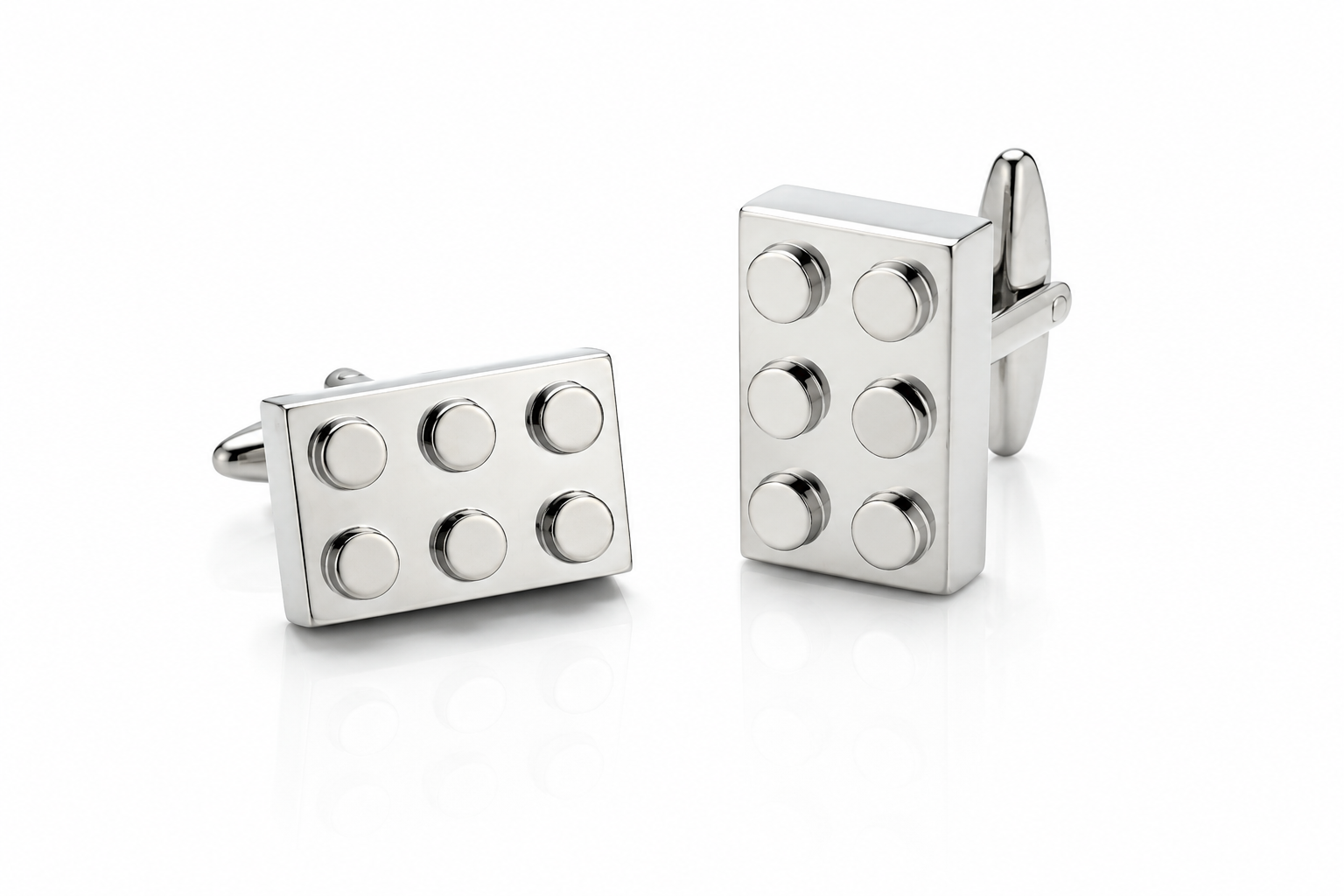 Pair of silver building block cufflinks featuring six raised studs and bullet back closures