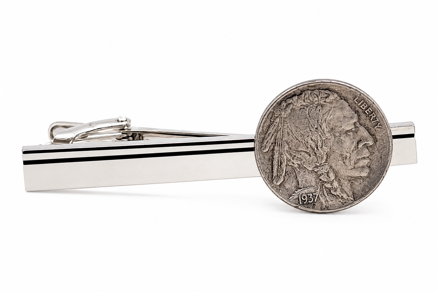 A silver-toned metal tie clip bar with two thin black horizontal stripes, shown alongside a 1937 Buffalo nickel coin for scale, on a clean white background.