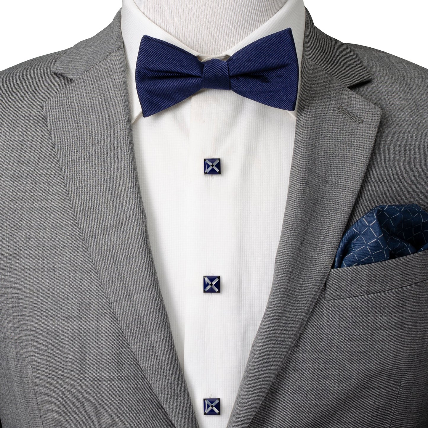 Gray suit with a navy bow tie and pocket square on a mannequin.