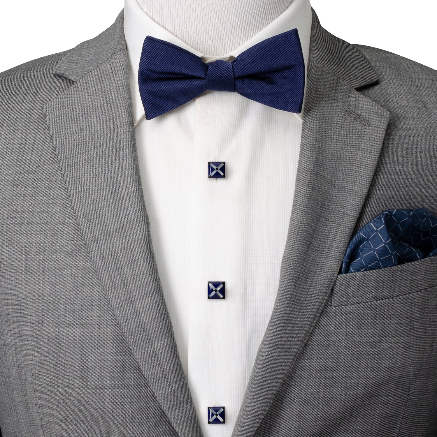 Gray suit with a navy bow tie and pocket square on a mannequin.