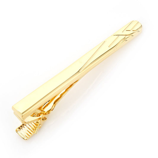 Gold tie clip on a white background