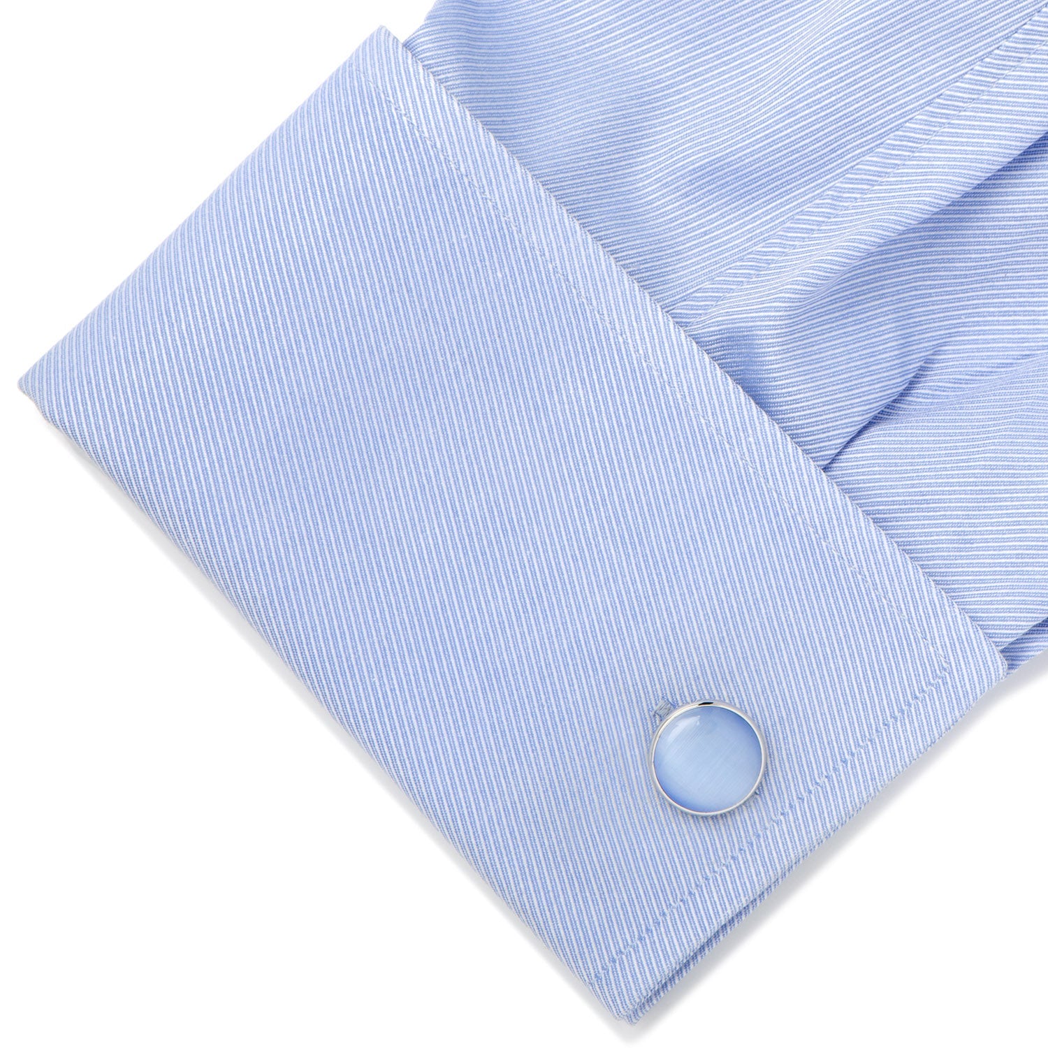 Light blue striped shirt cuff with a button on a white background