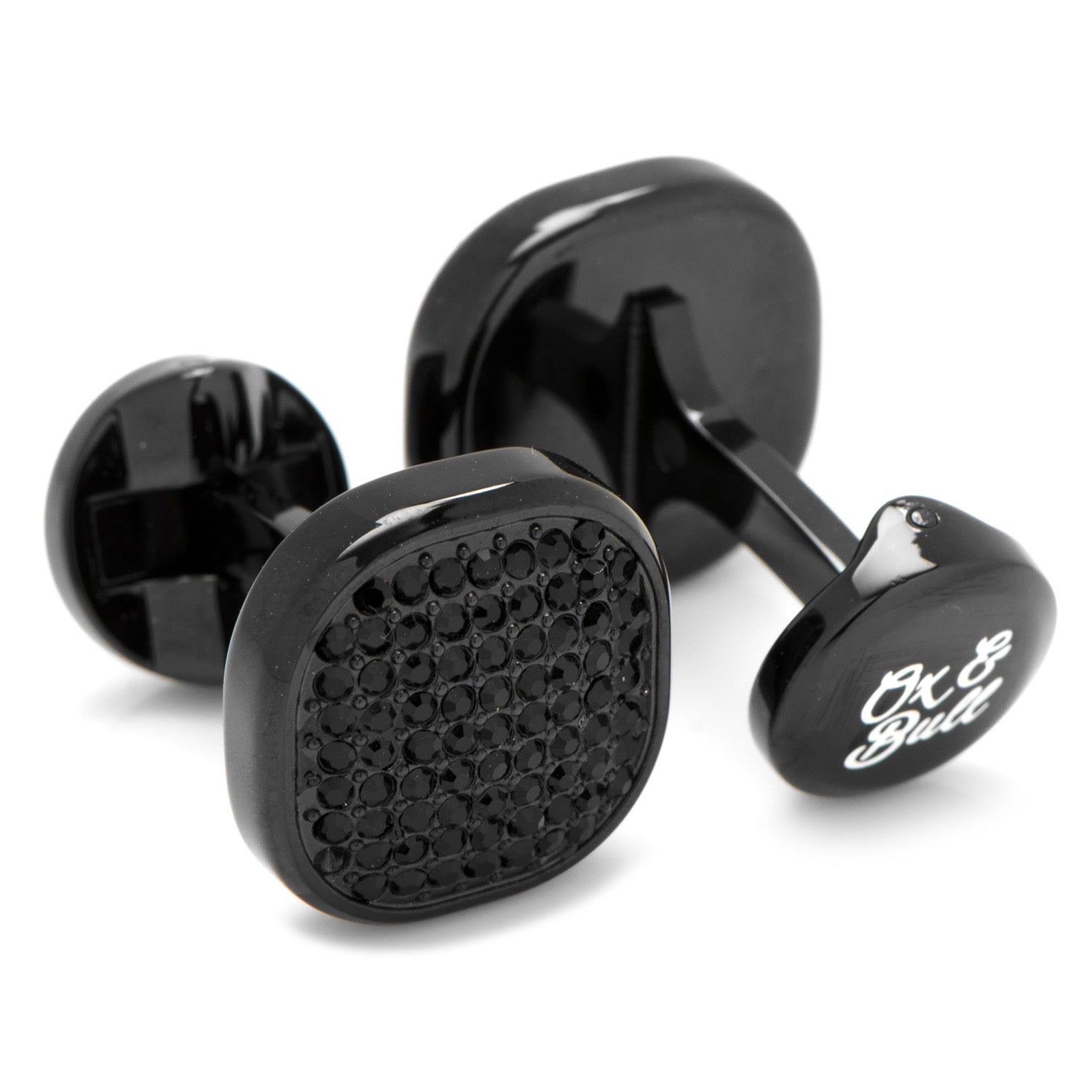 Black cufflinks with textured design and brand name on a white background