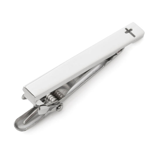 Silver tie clip with a cross design on a white background