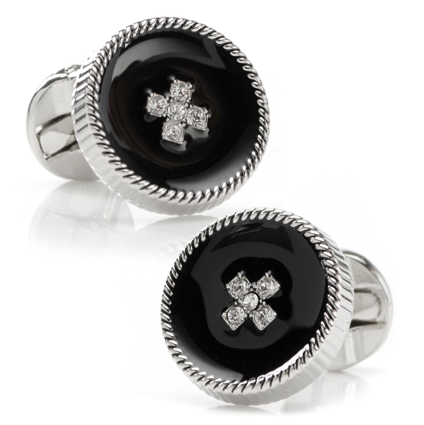 Pair of cufflinks with black center and silver cross design on a white background