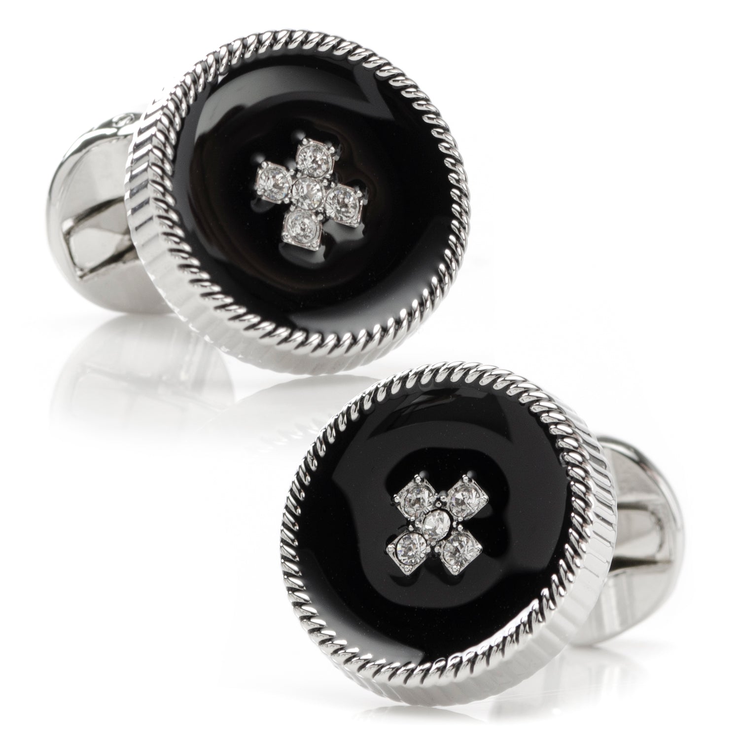 Pair of cufflinks with black center and silver cross design on a white background