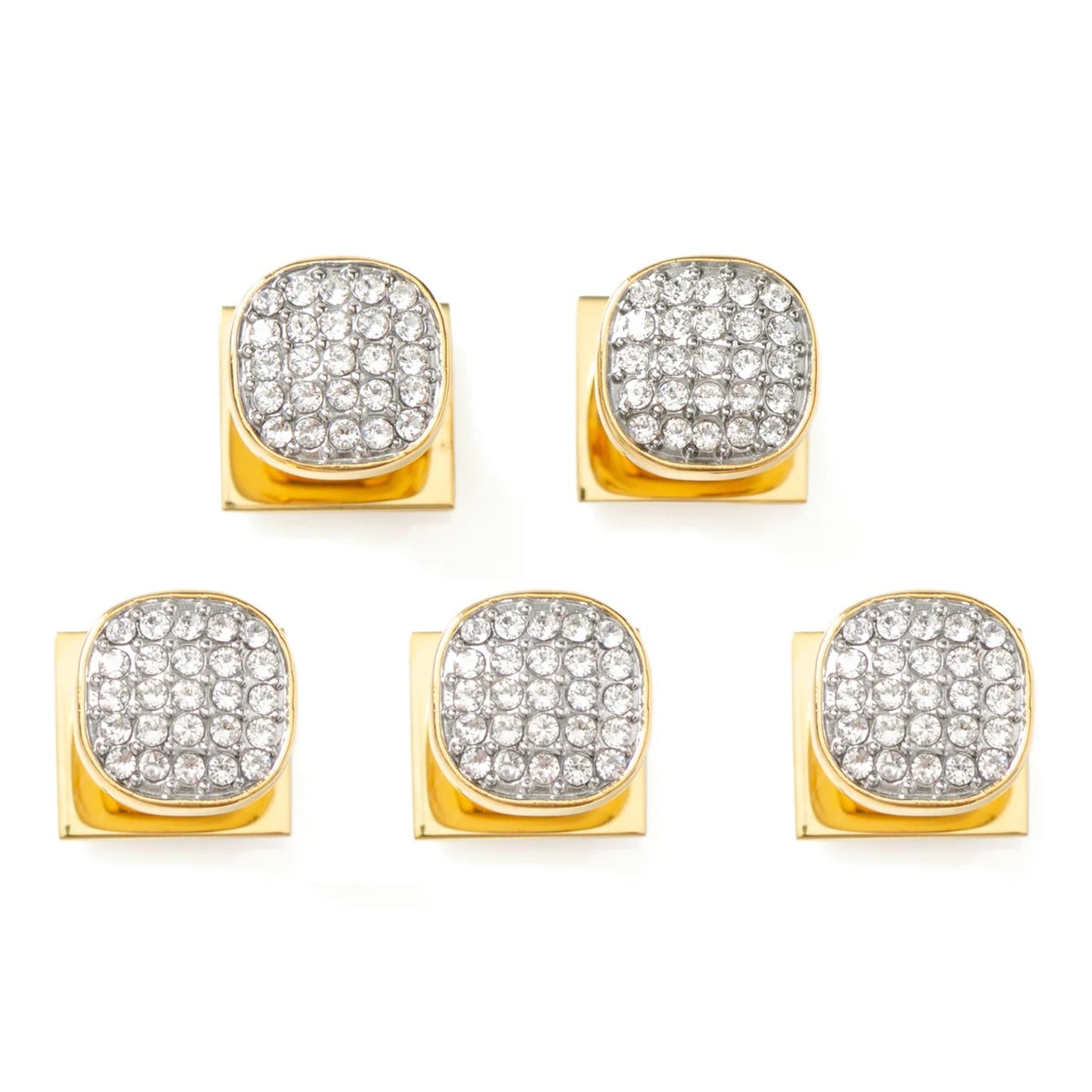 Set of gold earrings with clear gemstones on a white background