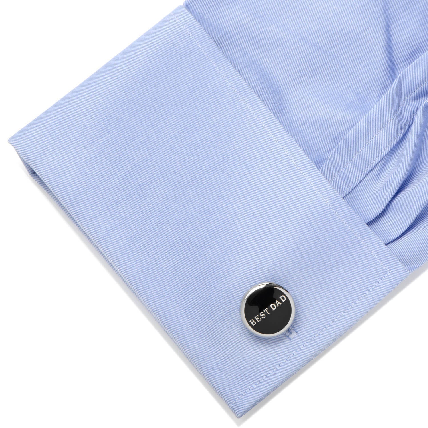 Cufflink with 'BEST DAD' text on a light blue shirt cuff