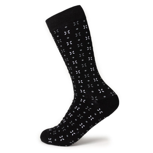 Black sock with white floral pattern on a white background