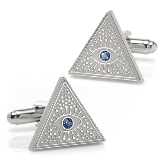 Triangular cufflinks with eye design and blue gemstones on a white background
