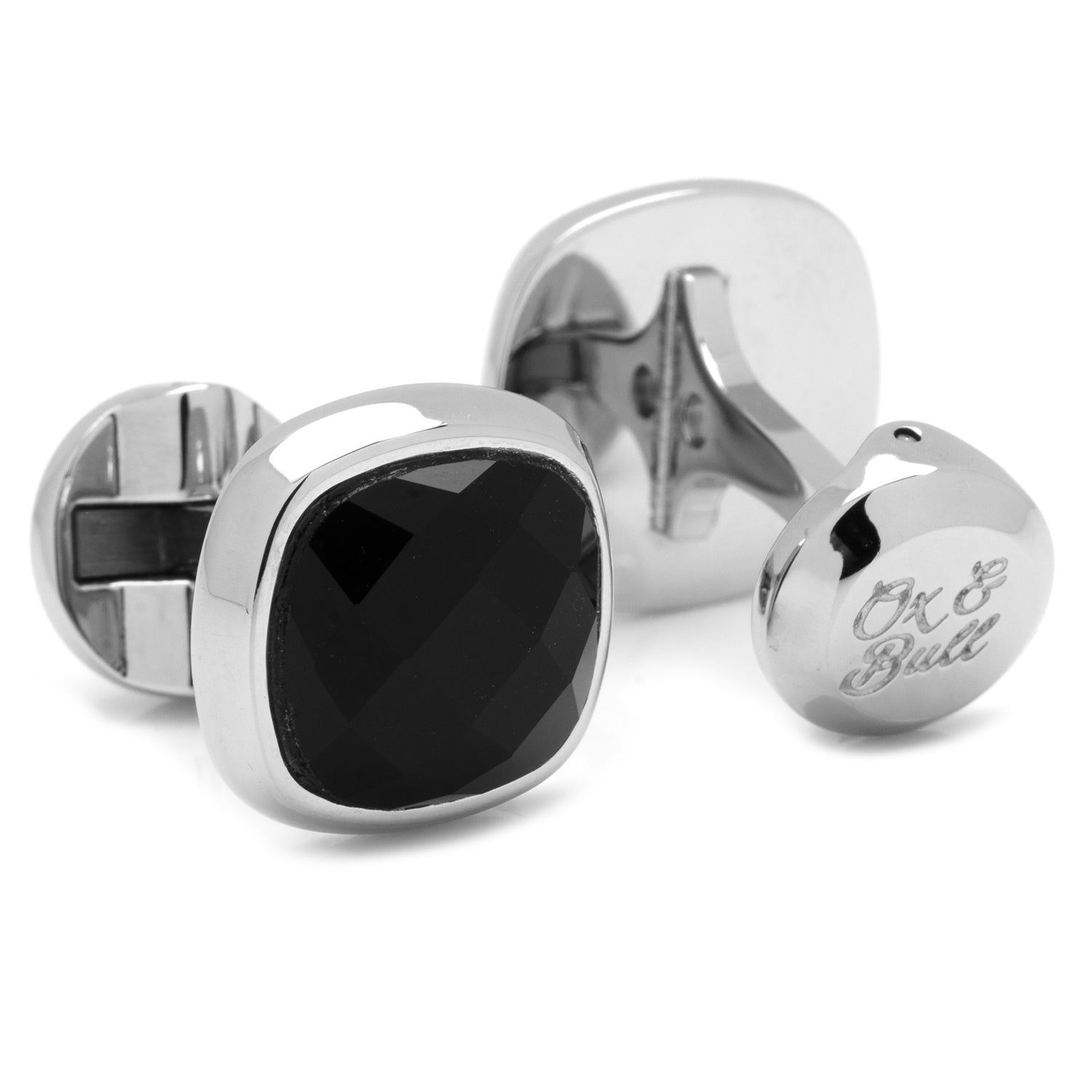 Silver cufflinks with a black gemstone on a white background