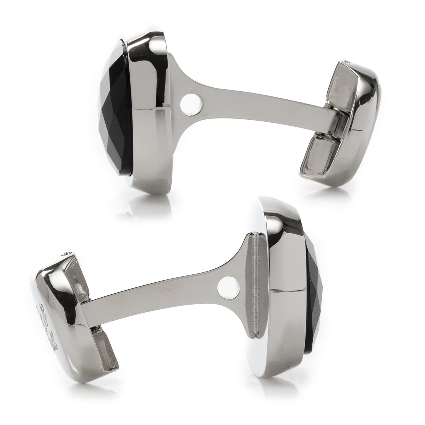 Pair of silver cufflinks with a black accent on a white background
