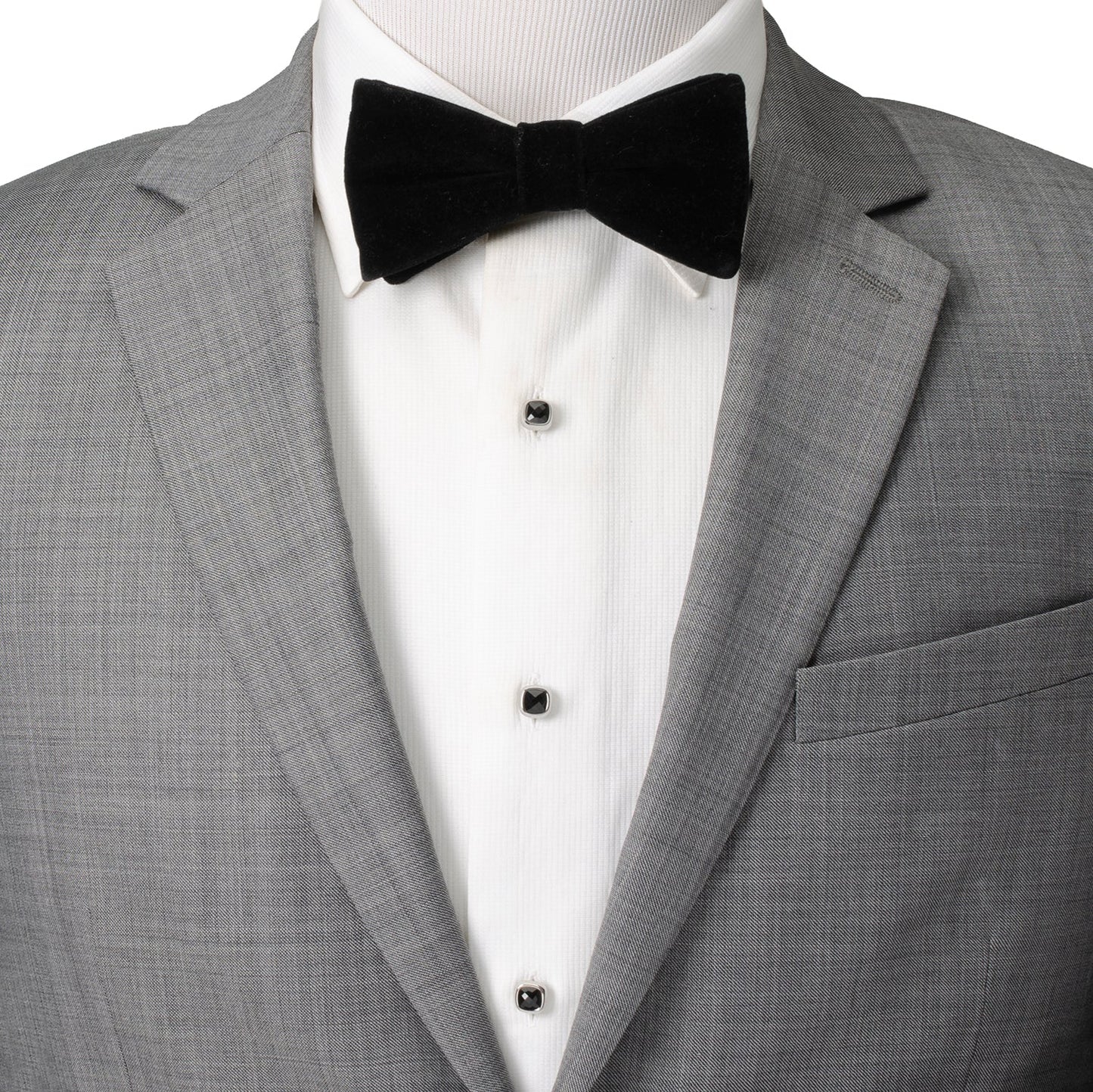 Gray tuxedo with a black bow tie on a mannequin against a white background