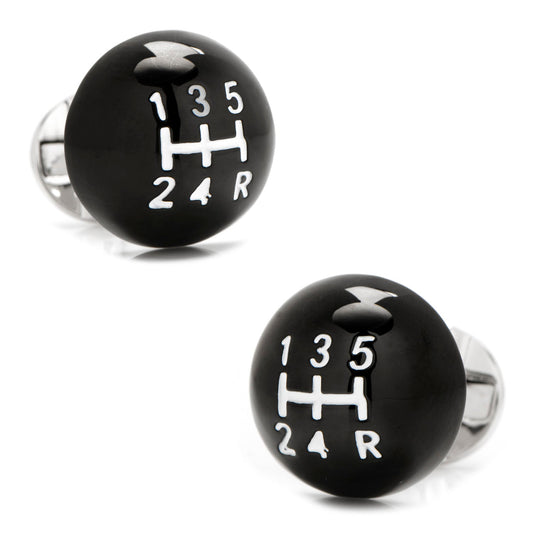Black gear shift cufflinks with white numbering on a white background