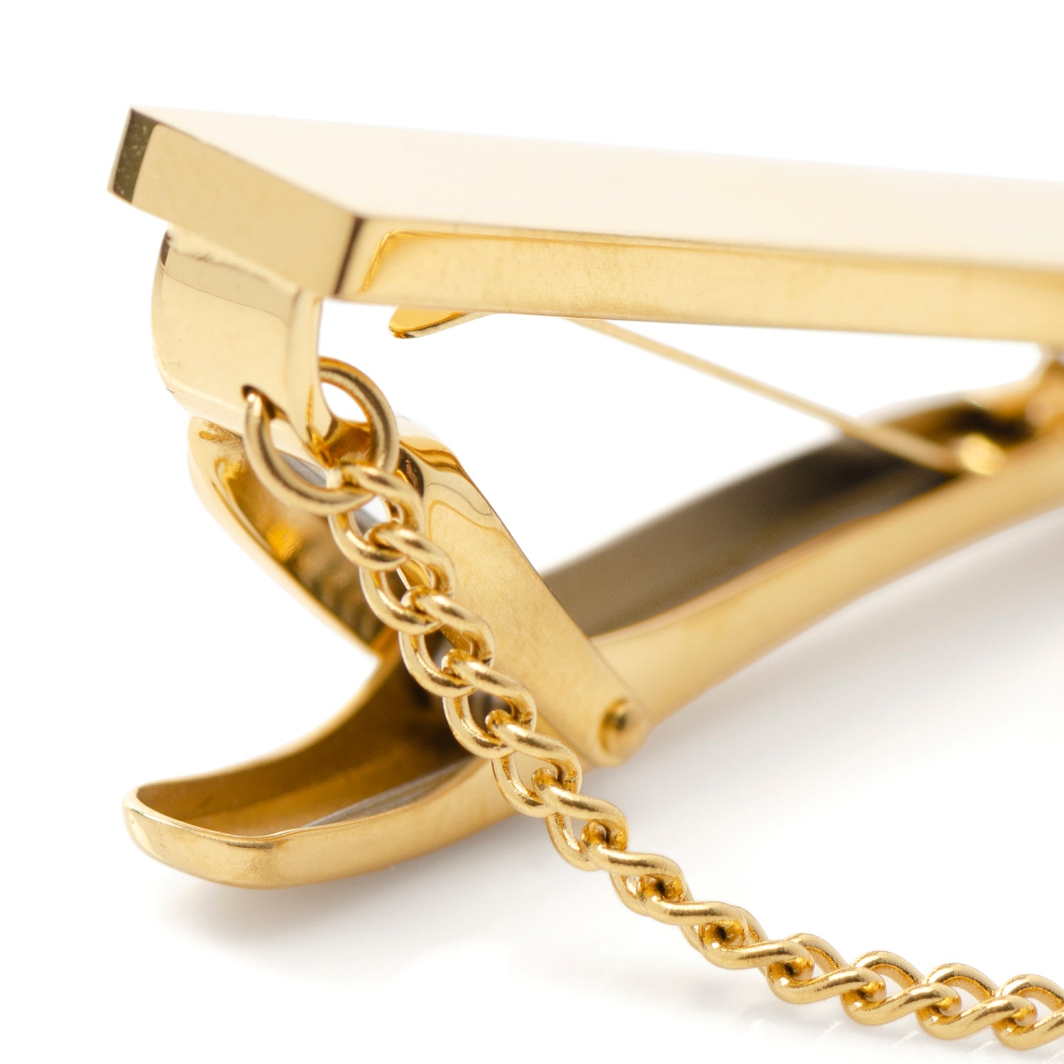 Gold hair clip with chain detail on a white background