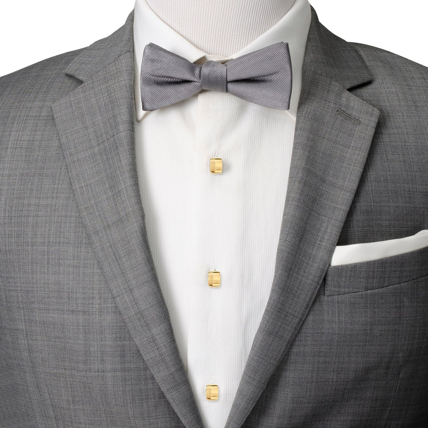 Gray suit jacket with a gray bow tie and white shirt on a mannequin.