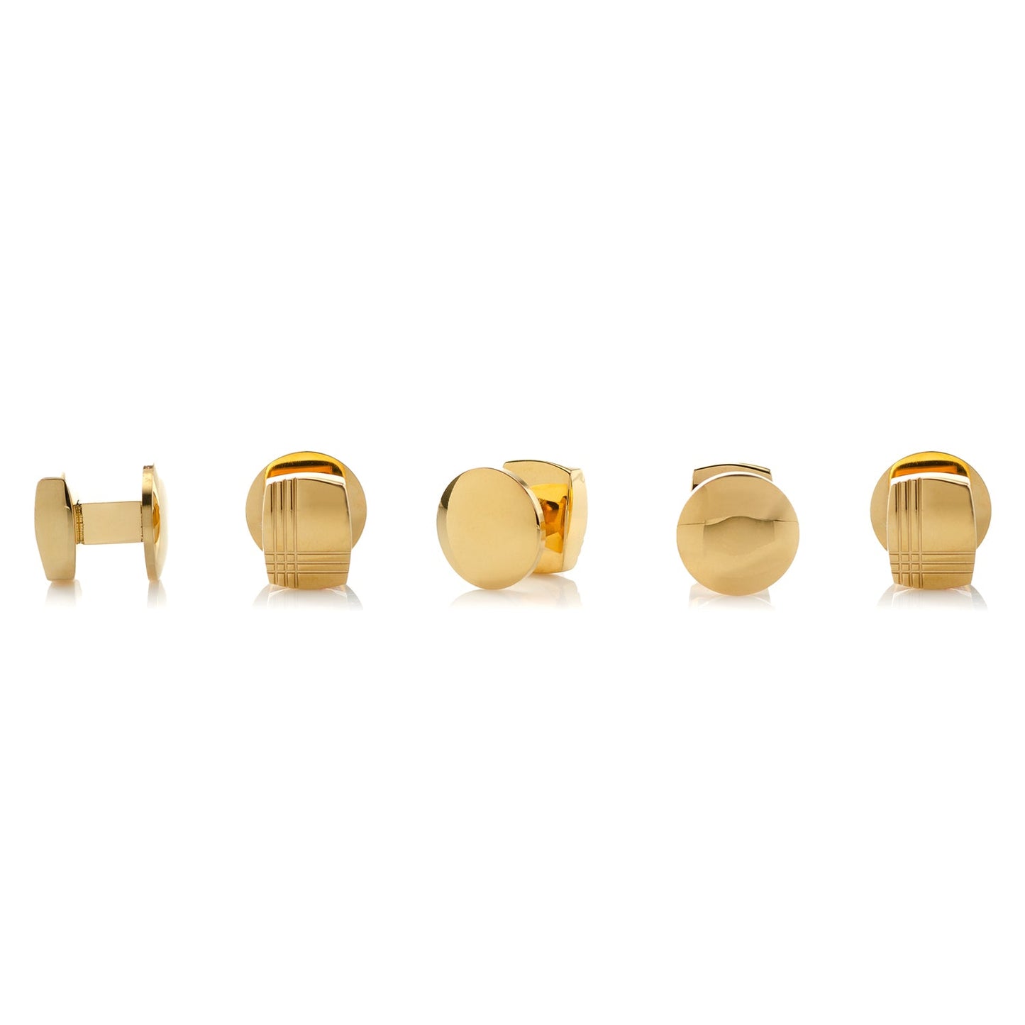 Set of gold cufflinks on a white background