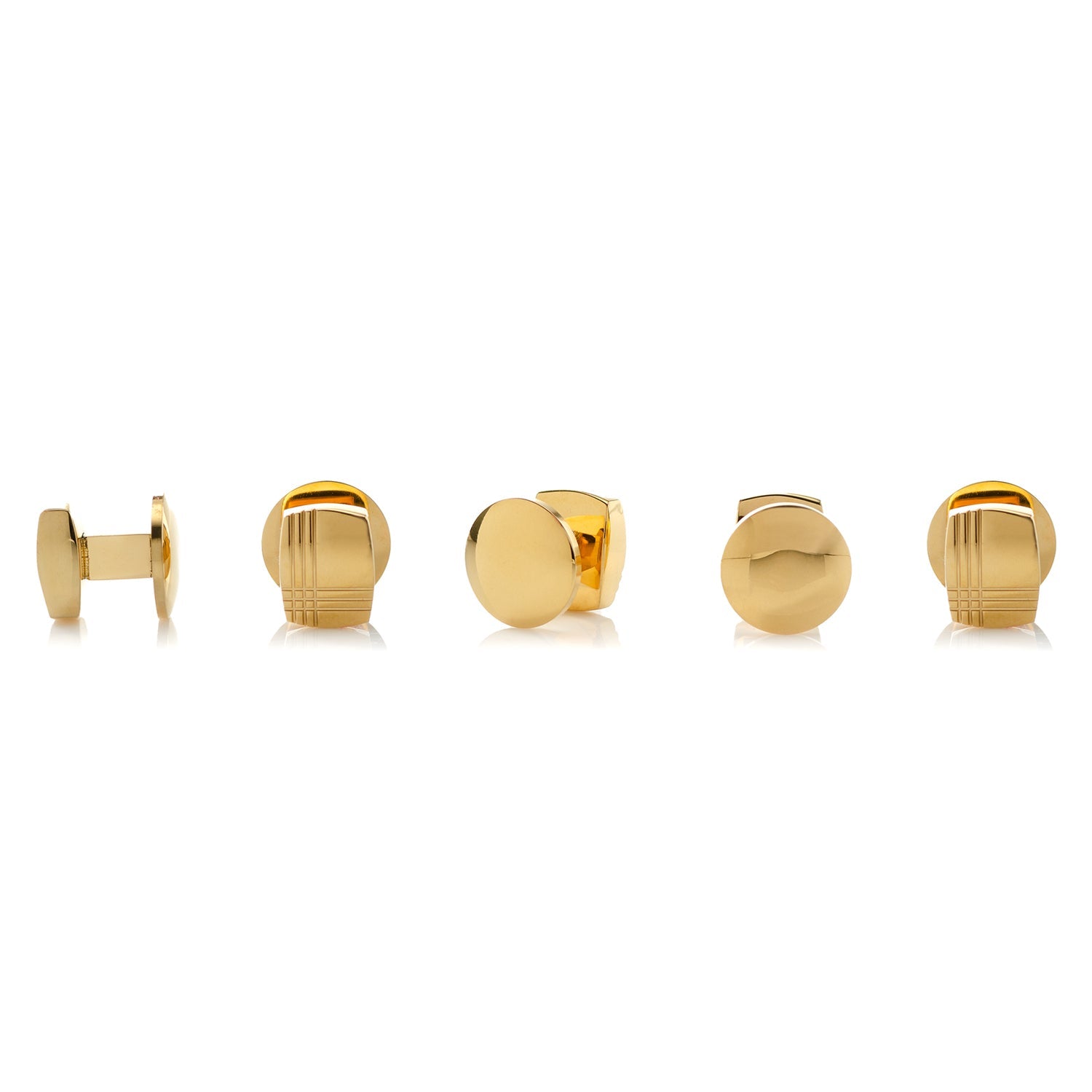 Set of gold cufflinks on a white background