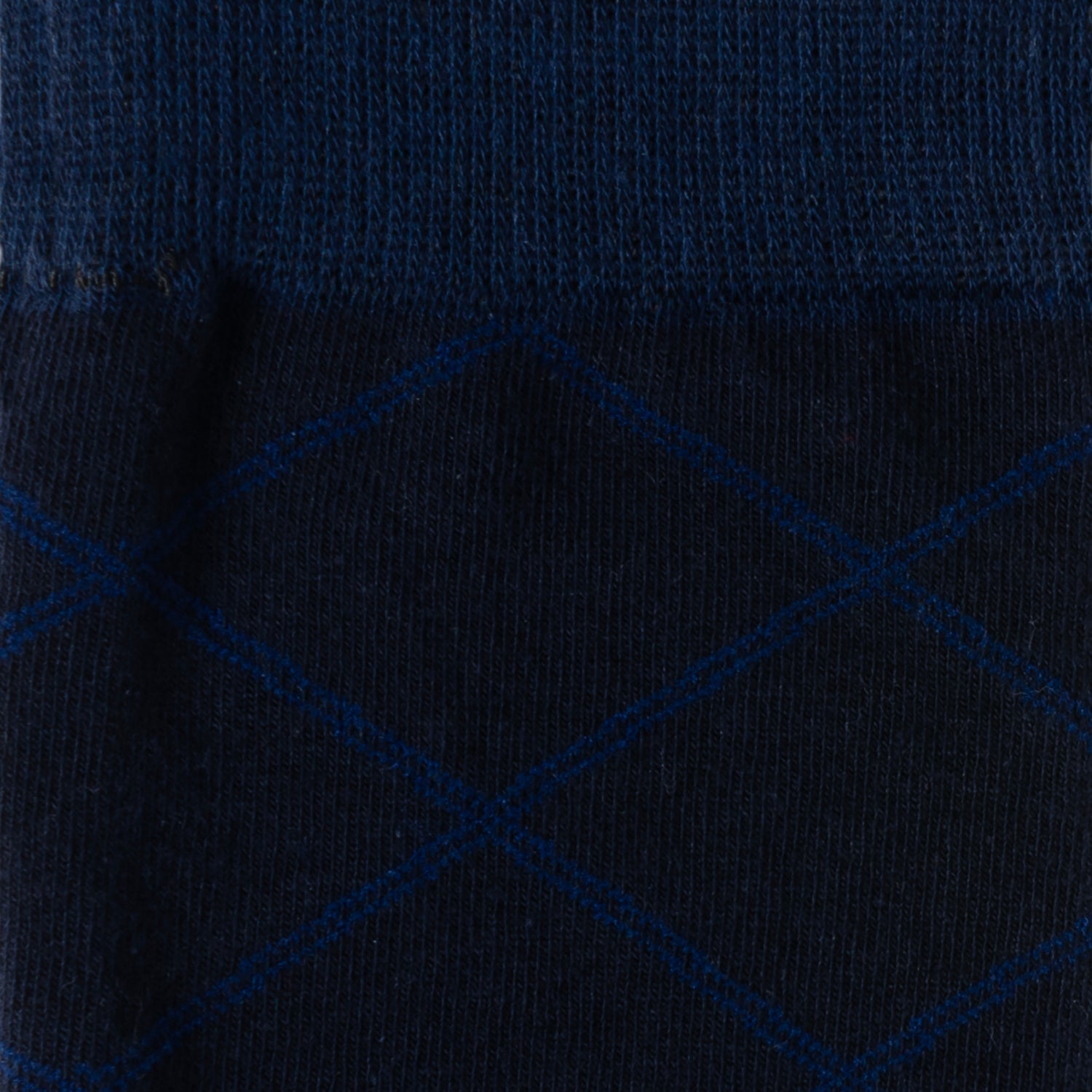 Close-up of a dark blue fabric with a subtle pattern
