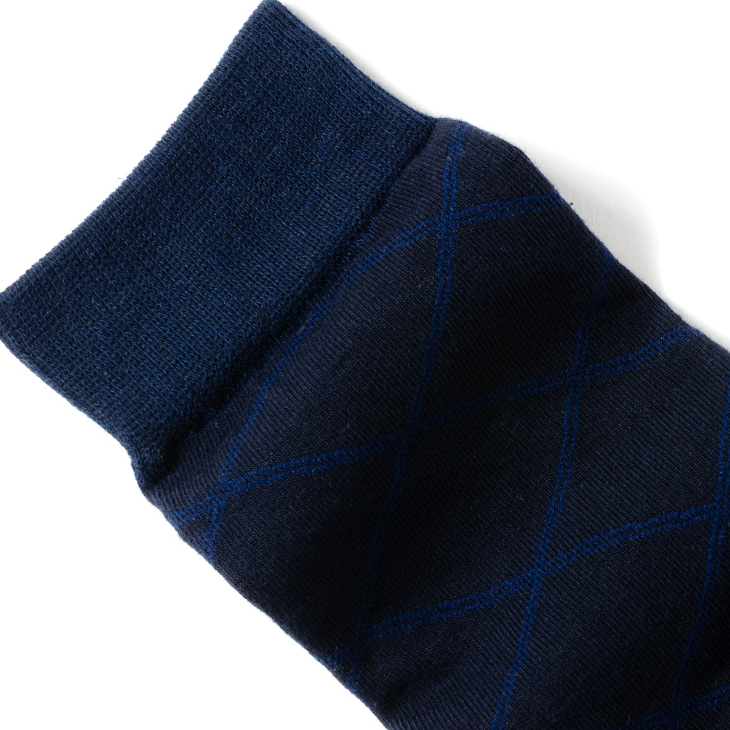 Navy sock with blue geometric pattern on a white background