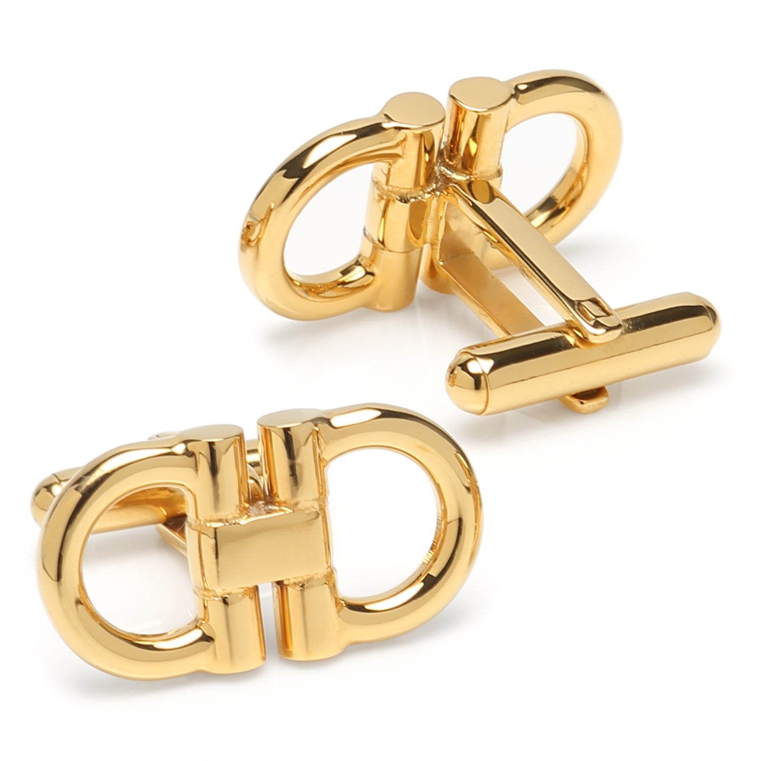 Gold cufflinks on a white background